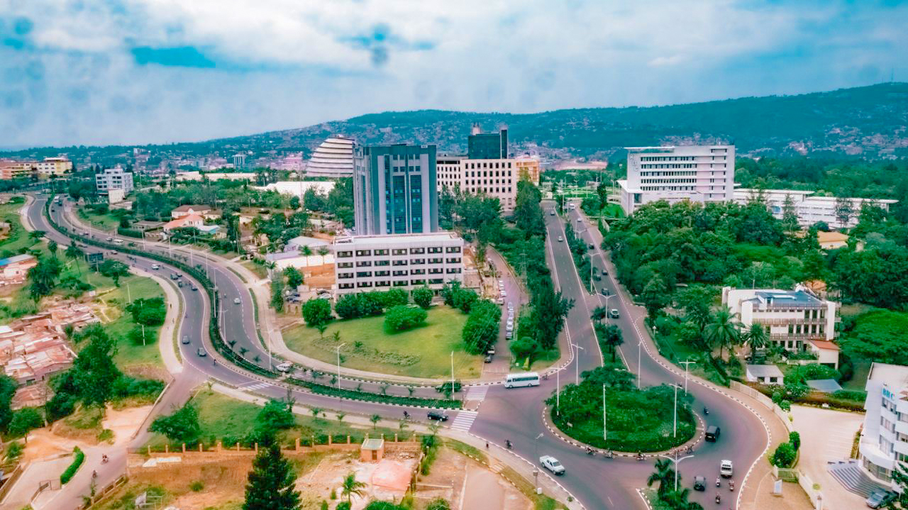 Aerial view of Kigali's business district, green boulevards and the hills behind